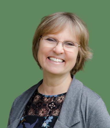 Professional accountant reviewing financial documents and calculations at a desk, representing accurate bookkeeping and accounting services.